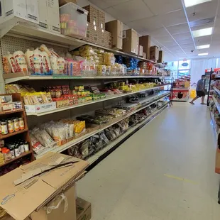 View from the back of the store towards the front in aisle 1, left side.
