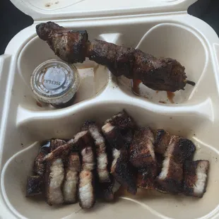 The pork belly with a pork skew on the side