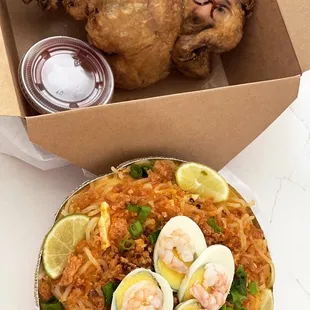 a meal in a box and a chicken dish