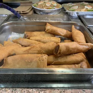 a variety of food items on a buffet table