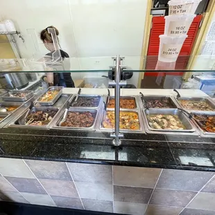 a buffet with a variety of food items