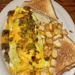 an omelet, toast, and potatoes on a plate