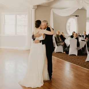 a bride and groom sharing a first dance