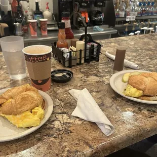 Egg, cheese and bacon sausage croissants at the counter