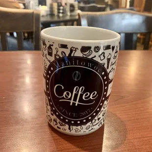 a coffee cup on a table