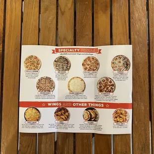 a menu on a wooden table