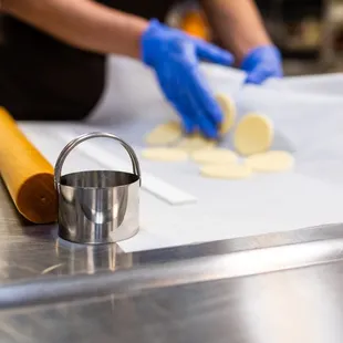 a person in a kitchen preparing food