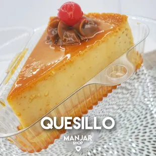 a piece of cheesecake with a raspberry on top