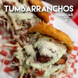 a close up of a sandwich with meat and cheese