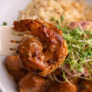 a plate of food with shrimp and rice