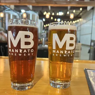 two glasses of beer on a table
