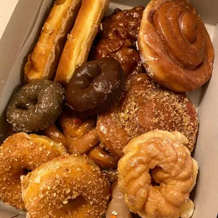 Crumb, cinnamon rolls, blueberry cake, chocolate cake, maple with sprinkles, maple bar, Apple fritter