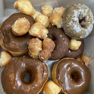 06.17.23 Ube donuts, chocolate glaze, Matcha donut, and a dozen donut holes
