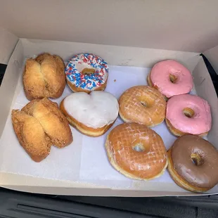 Glazed donut, chocolate glazed donut, strawberry glazed donut, vanilla glazed donut with sprinkles, heart vanilla glazed donut