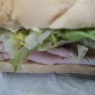 French bread, turkey, cheese, jalapeños, lettuce, olives, pepper, and onion