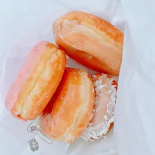 three donuts in a bag