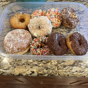lemon jelly donut bursting with goodness. Coconut, old fashioned, chocolate glazed, and a variety of festive sprinkled donuts.