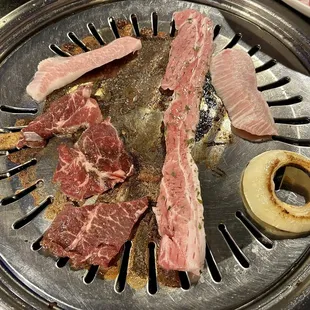 Bbq short ribs, pork belly, pork cheek, and some onion. This was our 5th or 6th meat order. We loved the beef meats the most!