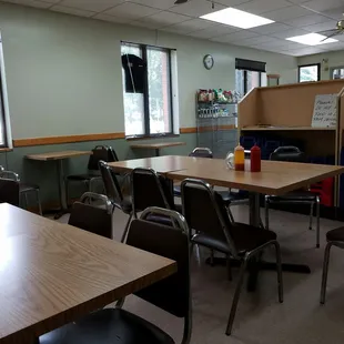a dining room with tables and chairs