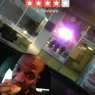 a man eating a donut