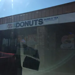 the reflection of a donut shop