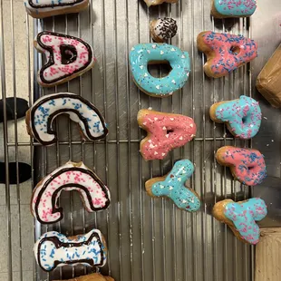 a number of doughnuts on a rack