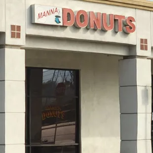 the entrance to a donut shop