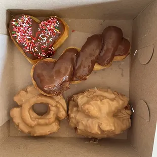 Heart shaped donut for Valentine's Day, chocolate twist, maple old fashioned, and maple buttermilk