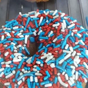 a variety of donuts with sprinkles
