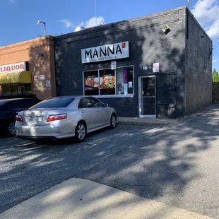 a car parked in front of a restaurant