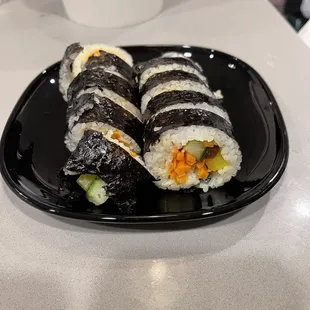 Gimbap. Tasty but very loosely wrapped so it fell apart. I didn&apos;t want to eat it after that!