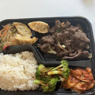 Steak Dosirak (contents: japchae, Mandu, broccoli, grilled Kimchi)