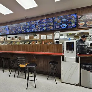 Cashier area and counter seats.