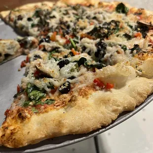 a slice of pizza on a pan