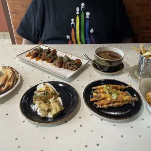 Small plate extravaganza! Lebanese dip, wings, bne broth, fries, elote tots, fried carrots, artichoke