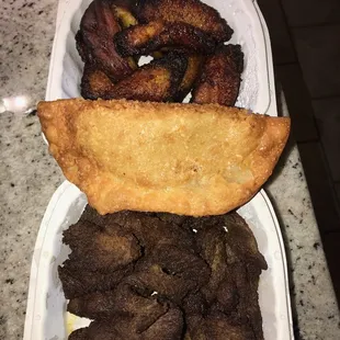 This was supposed to have been &quot;Mofongo&quot; con &quot;carne frita&quot;, &quot;empanadas&quot; de pollo, and maduros.