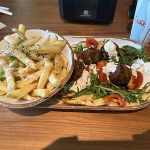 Falafel handheld with Za&apos;Atar fries
