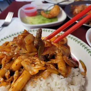 Dipped the shrimp tempura in the rice cake sauce