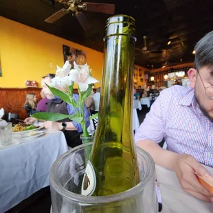 a man sitting at a table in a restaurant