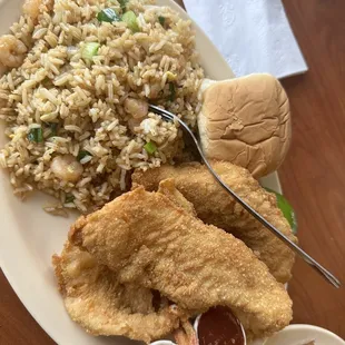 a plate of fried fish, rice, and a sandwich