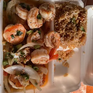 shrimp and rice in a styrofoam container