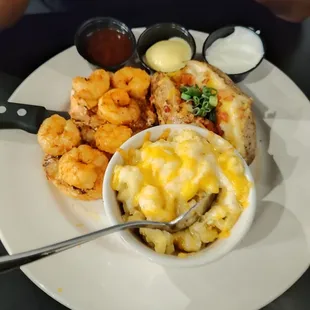 Grilled chicken and shrimp.  Mac n&apos; cheese Loaded baked potato