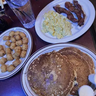 Scrambled eggs &amp; bacon, tater tots, and chocolate chip pancakes
