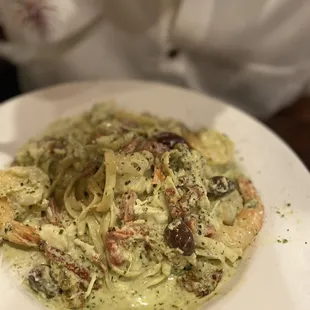 a plate of pasta with shrimp
