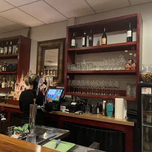 a woman behind the bar