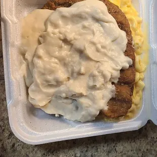 Tender and large Country Fried Steak smothered with a huge amount of white gravy, as requested, with 2 sides - double order of Mac n cheese.