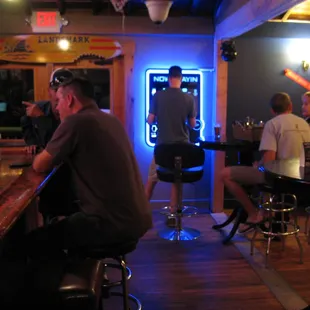 While this guy got up to use it, you can download the myTouchTunes app and not even have to get off your barstool.