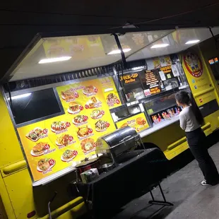 woman ordering food from a food truck