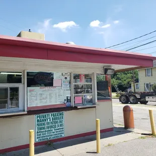 a man standing in front of a restaurant