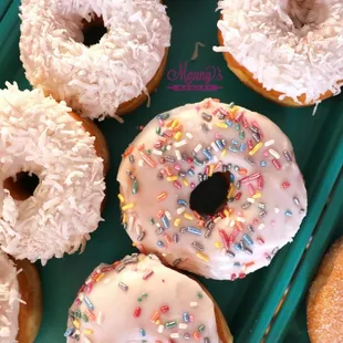 Delicious coconut and sprinkle donuts - available Friday and Saturday!